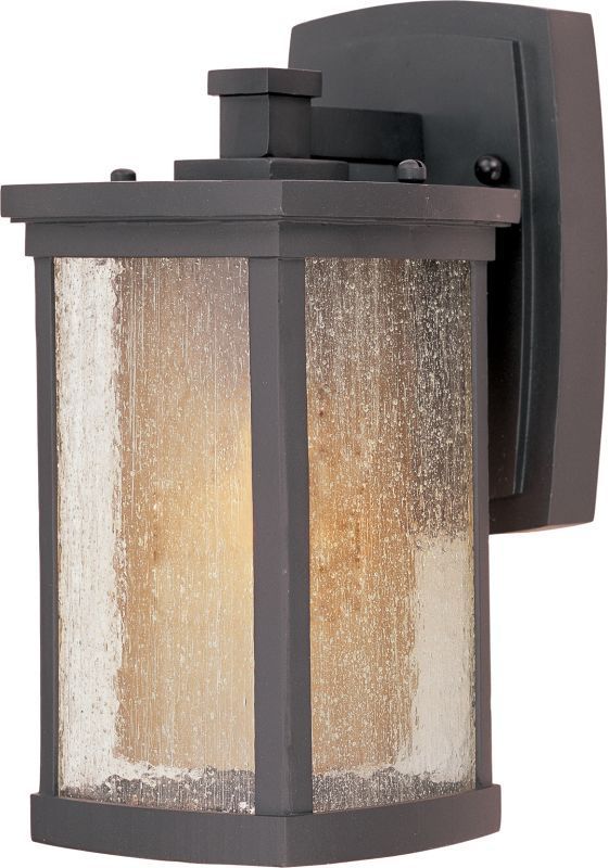 a light that is on the side of a wall with a glass paneled shade