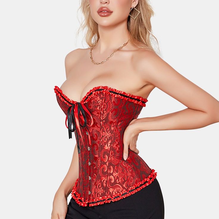 This stunningly overbust is the perfect corset to celebrate your love of Gothic and Steampunk style. Fetching ruffles along the bustline and across the hem add a touch of femininity and all this is topped off with a pretty bow at the centre of the bustline. Pair it up with a pair of jeans or a long flowing skirt depending on your preference and the style you wish to create. It features with the printing pattern. flexible boning to support. It fully show the lines of the waist and chest. Its over Fitted Corset With Attached Cancan, Fitted Corset With Attached Cancan For Costume Party, Gothic Strapless Corset For Halloween, Overbust Corset Dress With Attached Cancan, Gothic Strapless Costume Corset, Fitted Coquette Corset Dress For Halloween, Fitted Halloween Corset Dress In Coquette Style, Overbust Corset With Ruffles For Costume, Red Strapless Corset With Corset Back