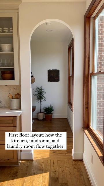 an archway leads to the kitchen and dining room