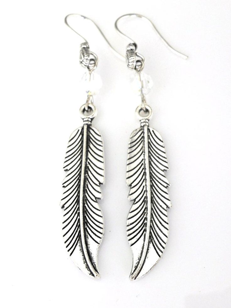 Long silver feather earrings with crystal tribal bohemian | Etsy Elegant Silver Feather Earrings, Silver Dangle Crystal Earrings For Festivals, Silver Bohemian Feather Earrings, Bohemian Silver Feather Earrings, Bohemian Silver Crystal Earrings Nickel Free, Bohemian Silver Crystal Drop Earrings, Bohemian Silver Crystal Earrings, Silver Bohemian Crystal Drop Earrings, Silver Bohemian Dangle Crystal Earrings