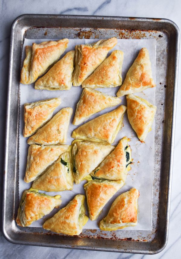 baked pastries on a baking sheet ready to go into the oven