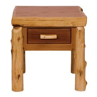 a small wooden table with two drawers on each side and one drawer at the top