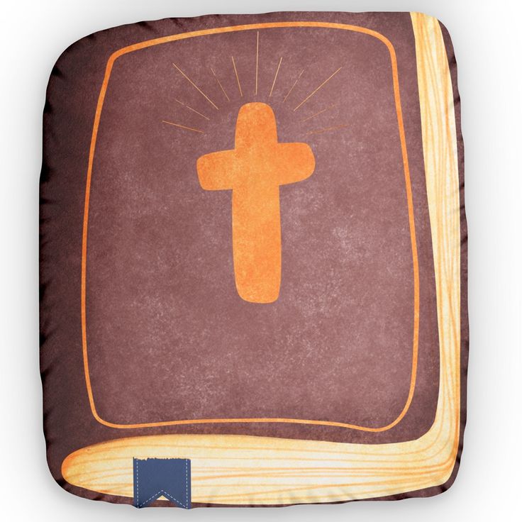 a brown and orange pillow with a cross on it