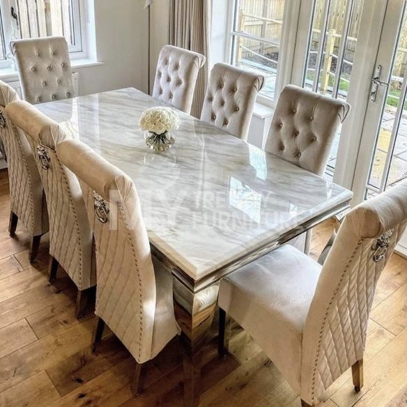 a dining room table and chairs with white marble top