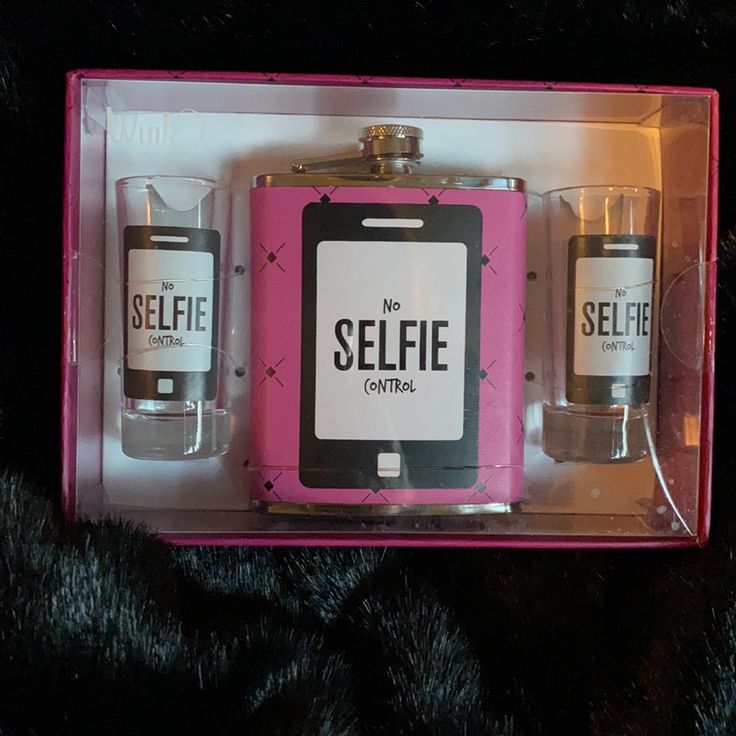 two flasks in a pink box with the words selfie on them