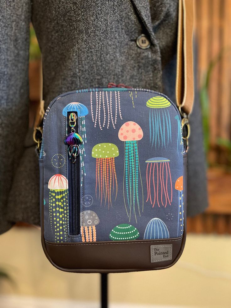 "This adorable convertible bag can be worn as a sling or a crossbody. The removable strap is 1.5 inch wide for comfort and is adjustable to about 60\". If this is too long for you, I can shorten it before shipping. Approximate size of bag is: 7\" long x 9\" high x 2.5\" wide at base" Adjustable Crossbody Bags For On-the-go, Versatile Adjustable Shoulder Bag For On-the-go, Travel Crossbody Satchel With Adjustable Strap, Versatile Crossbody Satchel With Adjustable Strap, Casual Crossbody Camera Bag For Everyday Use, Versatile Bags With Detachable Adjustable Strap, Travel Crossbody Shoulder Bag With Adjustable Strap, Versatile Adjustable Shoulder Bag For Everyday Use, Travel Camera Bag With Adjustable Crossbody Strap