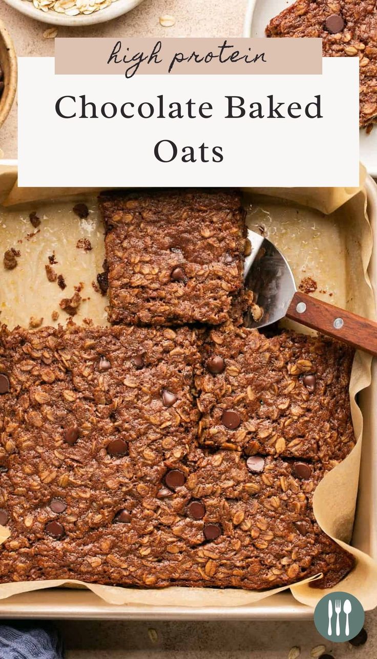 chocolate baked oats in a baking pan with spoons and plates on the side