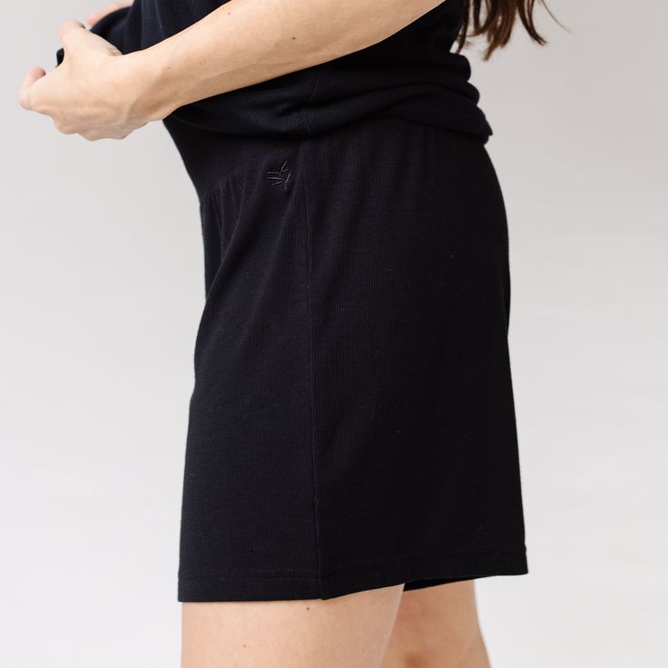 Shake up your loungewear with our Women’s Bamboo Rib-Knit Shorts. Featuring a thicker waistband that provides first-class coziness, these rib-knit bamboo shorts are crafted from a breathable bamboo viscose to keep your stems cool and carefree for a night of sleep or day of errands. No chafing, no riding up, no regrets. Wear them with our Women’s Rib-Knit Tee for a matching loungewear set. DETAILS: 97% Premium Viscose from Bamboo, 3% spandex Unique rib-knit viscose from bamboo fabric offers supre Cotton Sleepwear With Built-in Shorts For Relaxation, Cozy Black Sleepwear For Loungewear, Black Cozy Sleepwear For Loungewear, Black Cozy Sleepwear Loungewear, Comfortable Short Length Pajama Shorts For Loungewear, Cozy Solid Color Bottoms For Relaxation, Solid Color Shorts With Ribbed Waistband For Loungewear, Comfortable Sleepwear With Built-in Shorts And Relaxed Fit, Comfy Pajama Shorts For Lounging