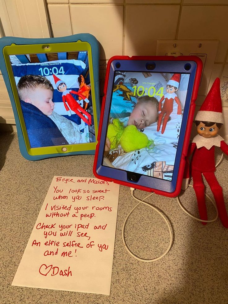 two children's personalized pictures are on the counter next to a note from an elf