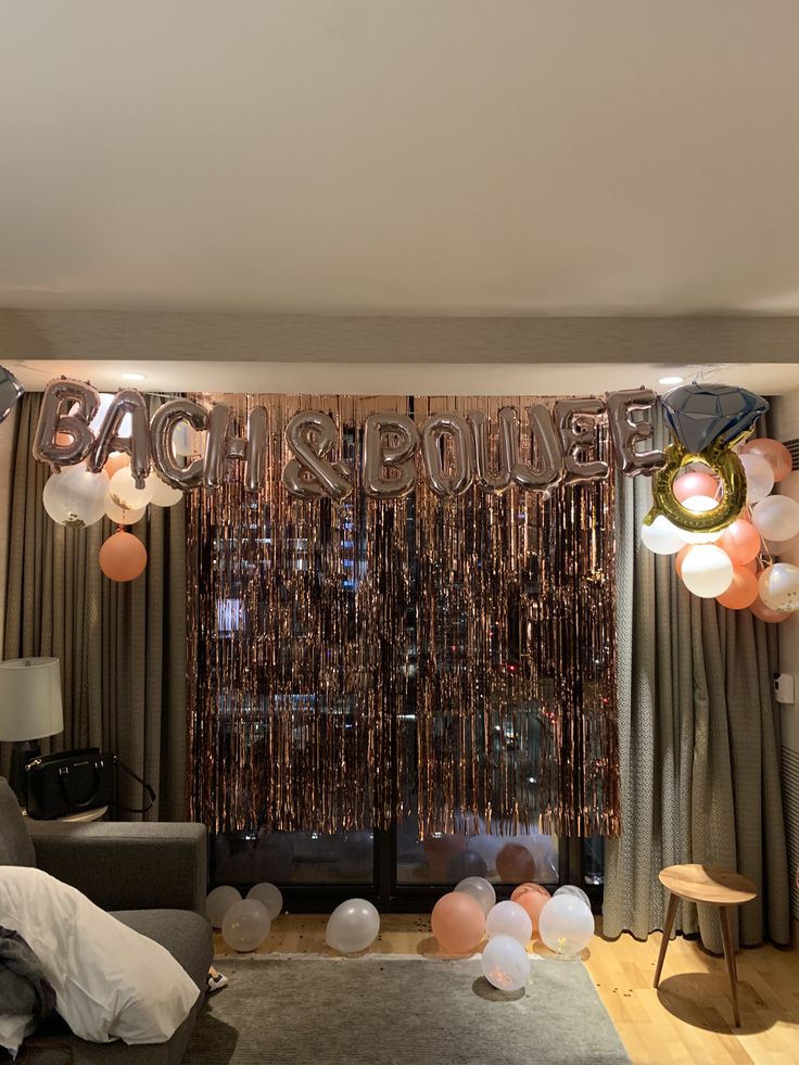 a living room filled with furniture and balloons