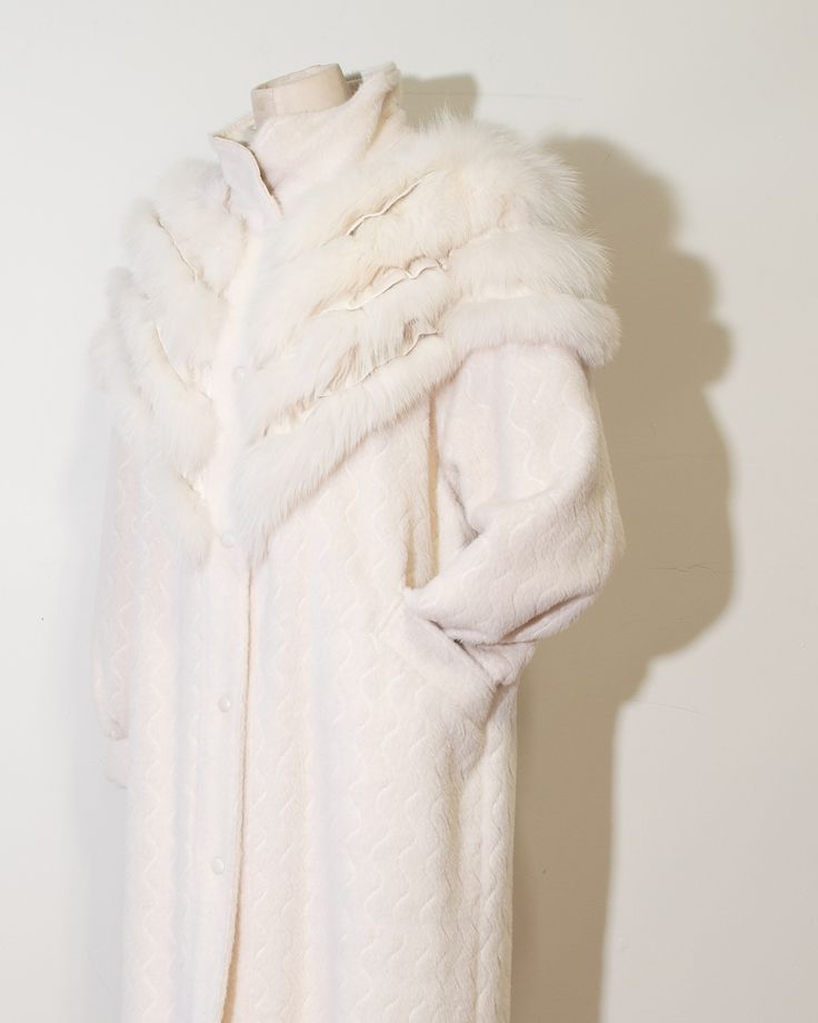 "Norma Canada Cream Alpaca and Fox Winter Coat Gorgeous Cream Statement alpaca coat with tiered fox fur & white leather detailing on chest & shoulders and leather lined collar for full coverage warmth, one of a kind , art to wear. A Norma Canada piece is always so special in every way. Incredible  Features: leather lined collar, leather coated button snaps, satin lining, two front/side pockets, white luxe satin lining, original manufacturers tag, tapered sleeve cuff with ruched detailing where sleeve meets cuff, squiggle detailing vertically on jacket, fox fur & leather tiered detail in the shape of a V across front & back of chest/shoulders area Label: Norma Canada Made in Canada Era: 1980s Marked Size: M Estimated Fit: M-L Fabric: dyed shadow fox detailing, 100% leather detailing, 70% al Formal Outerwear With Faux Fur Trim, Classic White Fur Coat For Winter, White Wool Coat For Winter Formal, Luxury White Fur Coat For Winter, White Fur Coat For Formal Winter Occasions, Luxury White Winter Fur Coat, White Wool Coat For Formal Winter Occasions, White Formal Fur Coat For Winter, White Fitted Long Fur Coat