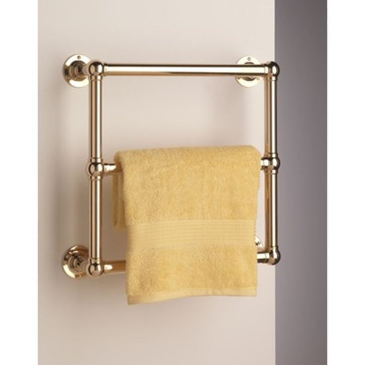 a towel rack with two towels hanging from it's sides and one folded yellow towel on the other side