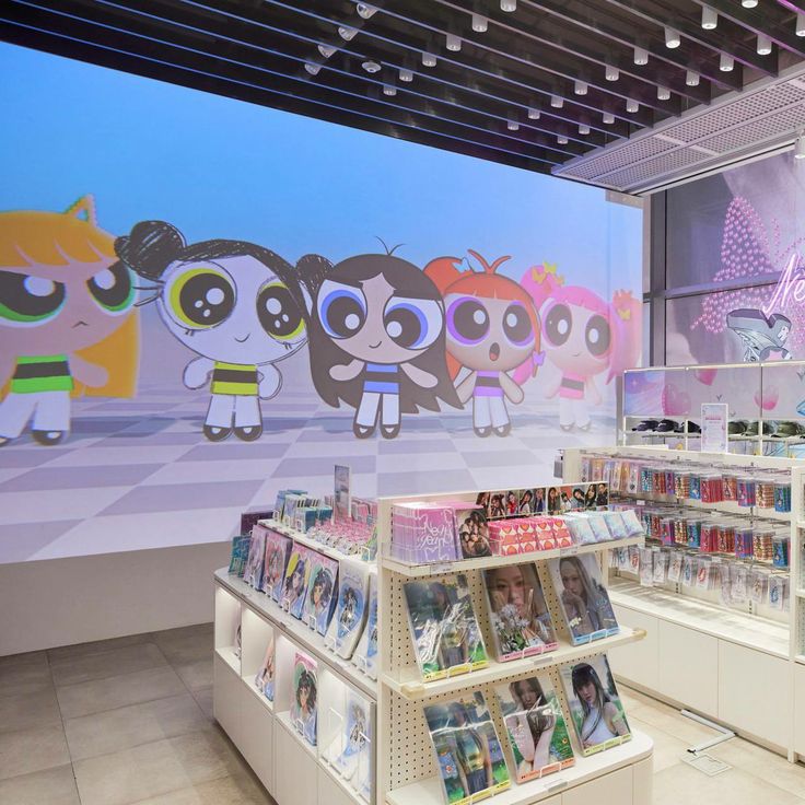 the inside of a children's book store with cartoon characters painted on the wall