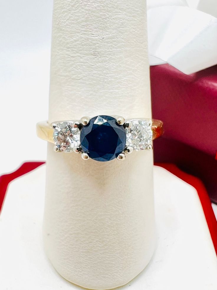 14K Yellow Gold Diamond 0.70ct Blue Sapphire 3 Stone Ring Size 8.25 A perfect gift for your loved one for any special occasion or holiday! Total Ring Weight: 4.62g Ring Length: 26.79mm Ring Width: 22.11mm Gemstone: Diamond Total Diamond: 0.70ct Item will be placed in a gift box. * Blue Sapphire Three Stone Ring With Diamonds, Blue Diamond Ring With Round Cut, Fine Jewelry Blue Three Stone Jewelry, Blue Round Cut Diamond Ring, Classic Blue Diamond Ring With Accents, Blue Three Stone Round Cut Diamond Ring, Sapphire Three Stone Diamond Ring For Anniversary, Anniversary Sapphire Three-stone Diamond Ring, Sapphire Three Stone Diamond Anniversary Ring