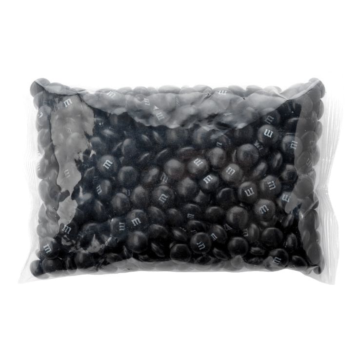 a bag of black beads on a white background