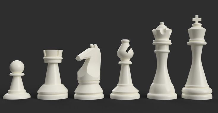 white chess pieces are lined up on a black surface with one king in the middle