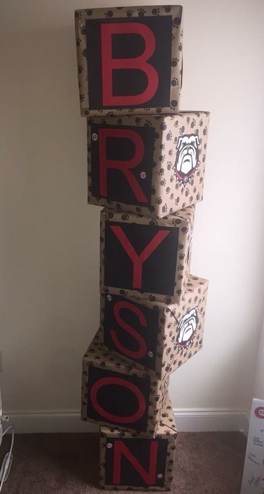 three boxes stacked on top of each other in the shape of letters that spell bryson