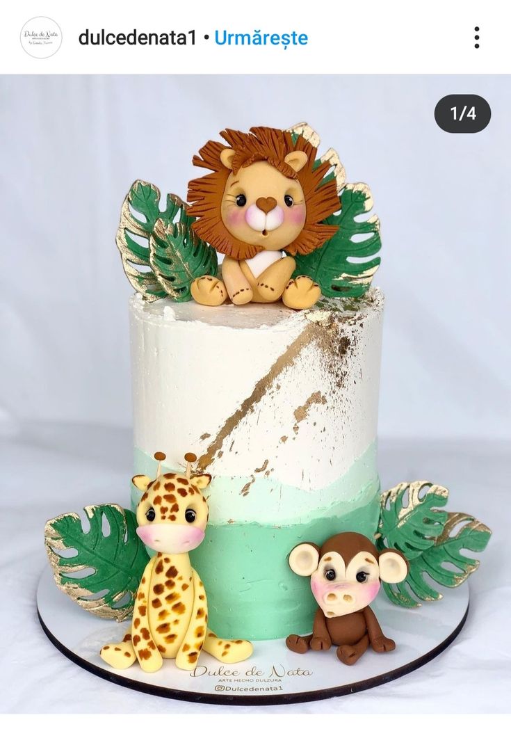 a cake decorated with an animal and giraffe on top