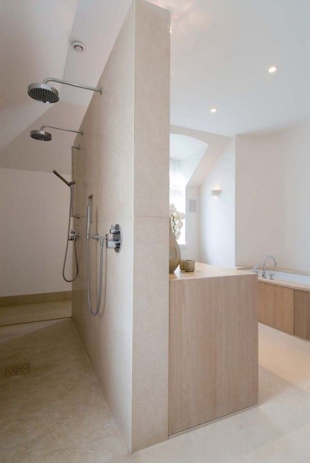 a large bathroom with a walk in shower next to a bathtub