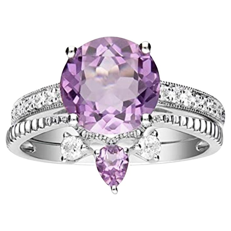 Stunning, timeless and classy eternity Engagement ring. Decorate yourself in luxury with this Gin & Grace ring. This ring is made up of 9MM Round-Cut Prong Setting Genuine Pink Amethyst (1pcs) 0.15 Carat, 3X4 Pear-Cut Prong Setting Genuine Light Pink Amethyst (1pcs) 2.47 Carat and Round-Cut Prong Setting Natural Diamond (18 pcs) 0.25 Carat accent stones for a lovely design. This ring is weight 3.62 grams. The ring is crafted of shining 14-karat White Gold and is completed by a highly polished fi Eternity Engagement Ring, 14k White Gold Diamond Ring, Amethyst And Diamond Ring, Light Amethyst, Amethyst Gem, White Gold Diamond Rings, Amethyst Jewelry, Pink Amethyst, Amethyst Pendant