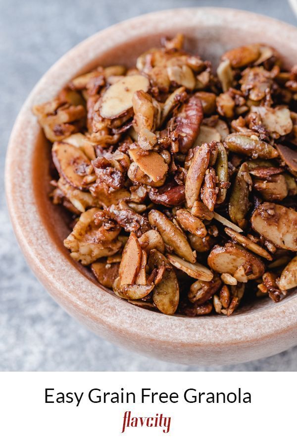 a bowl filled with granola sitting on top of a table