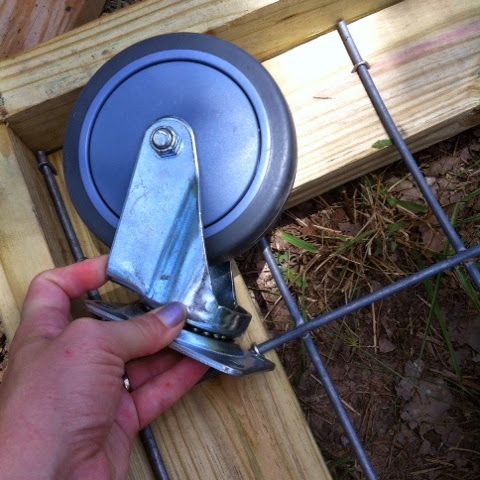 a person is holding a metal object in their hand and pulling it out of the ground