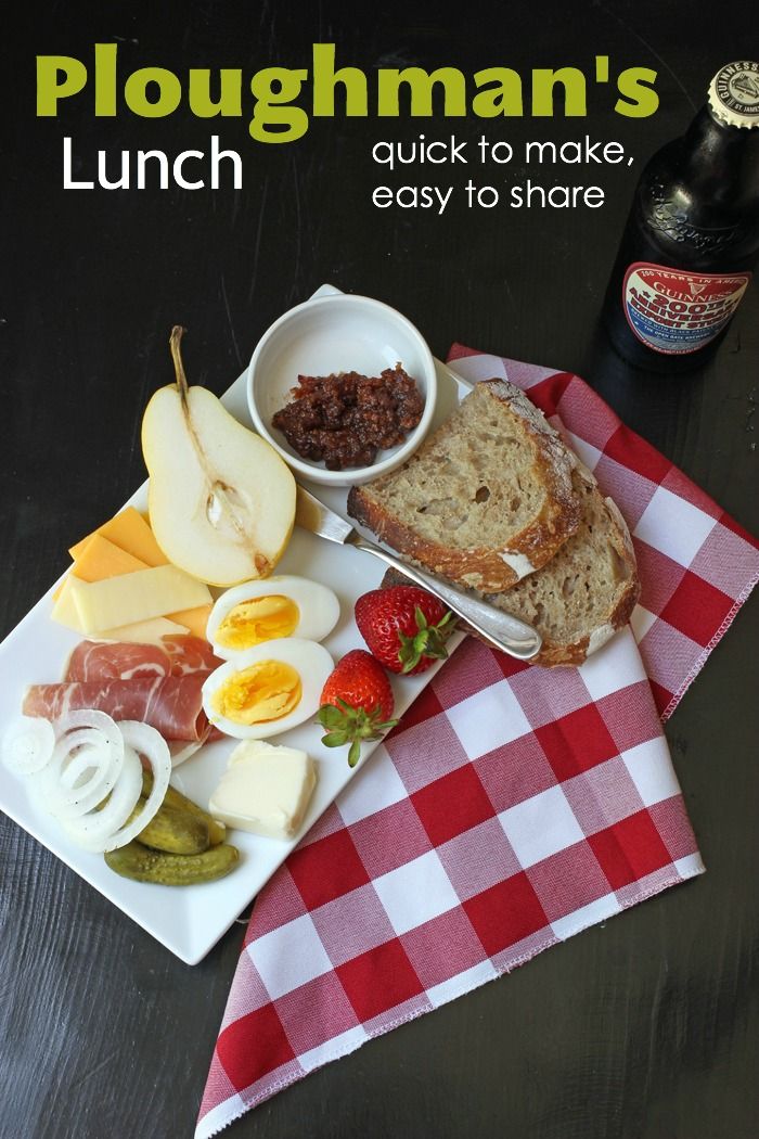 the cover of ploughman's lunch is shown with bread, fruit and cheese