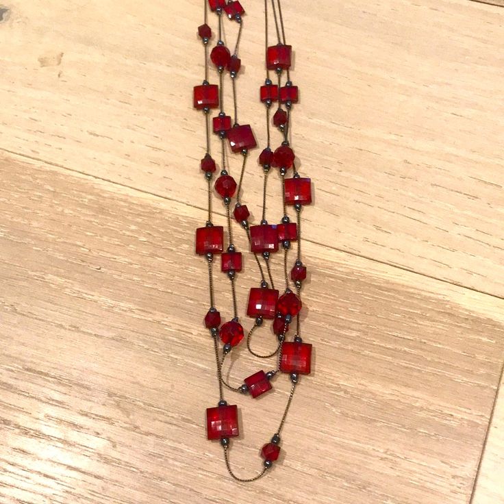 Never Worn Long Red Beaded 3 Strand Necklace. Elegant Red Long Necklace With Round Beads, Red Double Strand Beaded Chain Jewelry, Red Long Beaded Necklaces For Party, Long Red Beaded Necklaces For Parties, Red Long Beaded Necklace For Party, Red Multi-strand Beaded Chain Necklaces, Red Multi-strand Beaded Chain Necklace, Red Double Strand Beaded Necklaces, Multi-strand Red Necklace With Colorful Beads