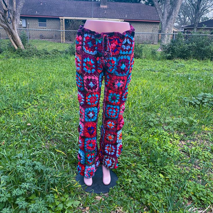 Handmade crochet flower pant now taking custom order,  please message for custom order your own measurements and design we have been selling our crochet cloths for while but this is our second project on crochet pant we made our own pattern on this Although we did get inspired by many other crochet artist from tiktok and etsy, our flowers and designs are our own and unique, you won't find anything like this, also we made 9 flowers from top to bottom for just you know good luck only one piece and Spring Festival Crochet Bottoms, Bohemian Crochet Cotton Bottoms, Bohemian Cotton Crochet Bottoms, Bohemian Crochet Bottoms For Festival, Spring Crochet Multicolor Bottoms, Bohemian Crochet Lace Bottoms For Festival, Spring Multicolor Crochet Bottoms, Hippie Crochet Bottoms For Beach, Casual Cotton Bottoms With Crochet Lace