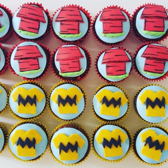 cupcakes decorated with red and yellow frosting