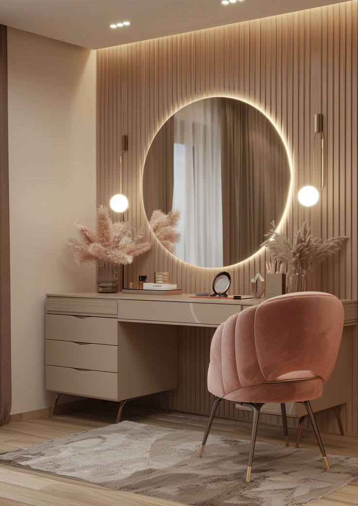 a pink chair sitting in front of a mirror on top of a wooden desk next to a dresser