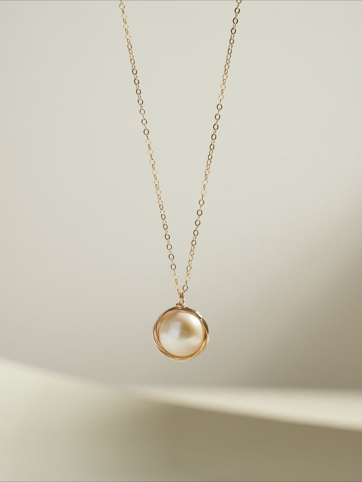 This exquisite piece combines timeless elegance with modern sophistication. Featuring a single, lustrous Edison pearl delicately suspended from a filigree chain, it exudes refined beauty and grace. Perfect for both formal occasions and everyday wear, this necklace adds a touch of understated luxury to any ensemble. Elevate your style with the timeless charm of Coco Kim. Metal: 14k Gold Filled Pearl: Freshwater Pearls Pendant Dimensions: 13mm Total Length: 450mm(includes adjustable chain) Single Pearl Pendant, Single Pearl Necklace, Edison Pearls, Single Pearl, Understated Luxury, Charm Pendant Necklace, Pearl Pendant, Charm Pendant, Freshwater Pearls