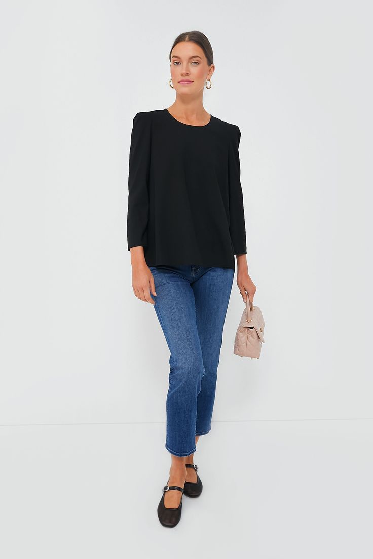 Simple, chic, and classic, the Black Bedford Top is the wardrobe essential that’ll give your closet the refresh it needs. With slightly structured shoulders and a high to low hem, this sophisticated number can be tucked in or out depending on your look. Pair with trousers and flats for an elevated office look or opt for denim and platform heels for an effortless party outfit that’ll have you ready in 5 minutes flat! Scoop neckline Structured shoulders Bracelet length sleeves Relaxed fit Material Classic Tops With Structured Shoulders For Fall, Chic Stretch Blouse For Business Casual, Structured Classic Tops For Spring, Structured Tops For Work In Fall, Structured Fall Workwear Tops, Structured Tops For Fall Workwear, Sleek Relaxed Fit Blouse For Work, Classic Structured Top For Workwear, Chic Relaxed Fit Top For Business Casual