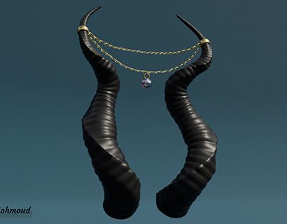 two black horns with chains on them are hanging from the ceiling in front of a blue sky