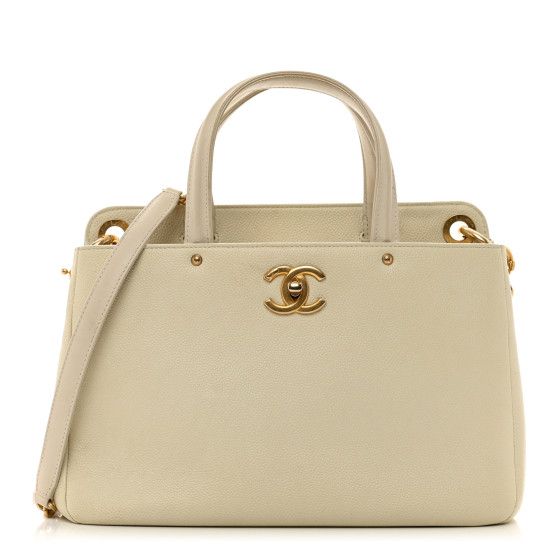 This is an authentic CHANEL Caviar Small Shopping Tote in White. The shoulder bag is crafted of caviar leather in white. The tote features  rolled leather top handles, an optional gold chain shoulder strap with a leather shoulder pad, and a facing polished gold Chanel CC turn lock. The top opens with the lockto a spacious white fabric interior with zipper and patch pockets. Elegant White Shoulder Bag With Cc Turnlock Closure, Elegant Tote Shoulder Bag With Cc Turnlock Closure, Luxury Cream Shoulder Bag With Rolled Handles, Luxury White Shoulder Bag With Rolled Handles, Luxury Shoulder Bag With Rolled Handles For Office, Elegant Shoulder Bag With Rolled Handles For Office, Elegant Formal Shoulder Bag With Rolled Handles, Luxury Formal Shoulder Bag With Rolled Handles, Gold Chanel