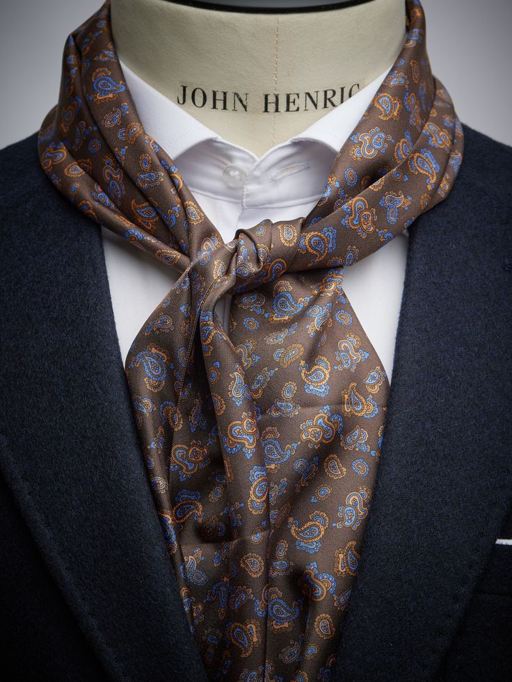 Men’s silk scarves – Brown silk scarf.
This brown silk scarf in a paisley print is a perfect relaxed but stylish alternative to the tie. The silk scarf is the perfect choice if you want to add an extra dimension to your look. Our silk scarves for men is sewn and manufactured with great care with tradition and genuine craftmanship. Classic Silk Scarves With Ties, Classic Business Scarves, Classic Brown Scarf For Formal Occasions, Classic Business Scarves With Ties, Classic Silk Scarf Neckwear, Classic Brown Silk Scarf, Formal Paisley Print Silk Scarf, Formal Silk Scarf With Paisley Print, Elegant Brown Silk Scarf For Formal Occasions