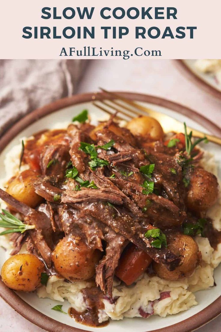 slow cooker sirloin tip roast on top of mashed potatoes