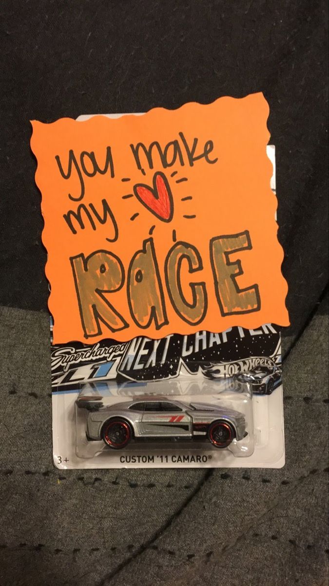 a toy car with an orange sign on it's back end that says, you make my heart my ridge