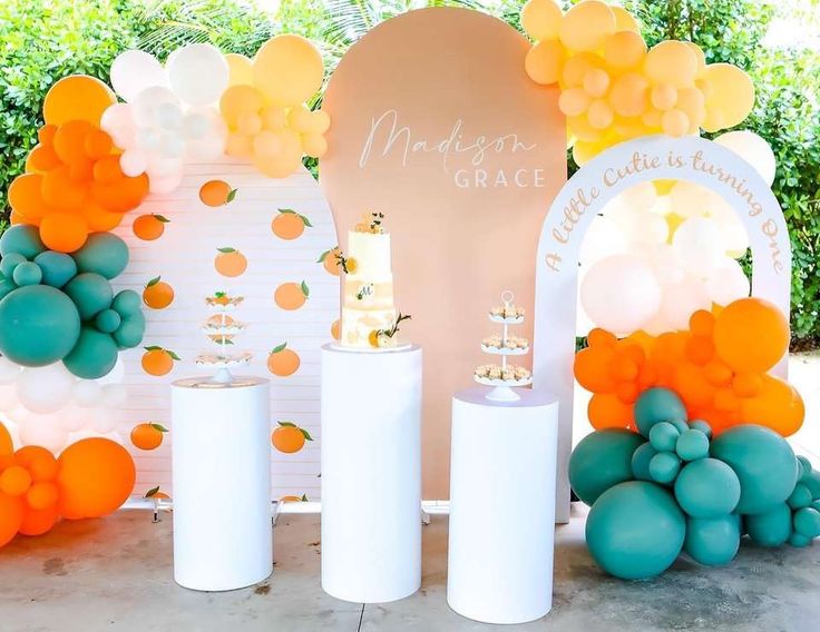 a table with balloons and flowers on it