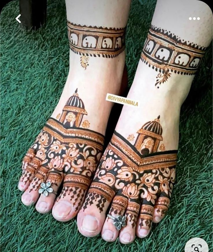 two feet with henna tattoos on them, one is showing the intricate design and the other has an ornate dome