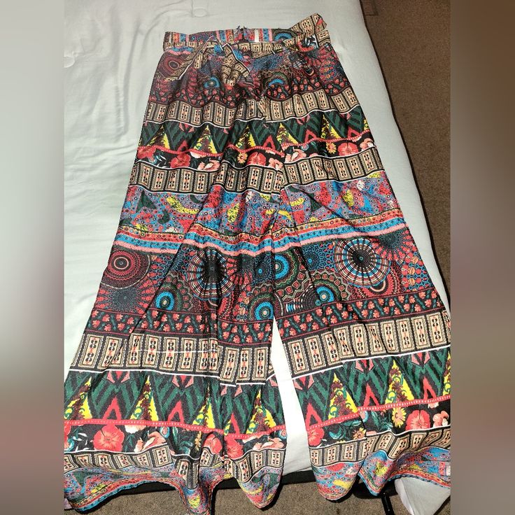 Nwot Size Large Polyester/Silk/Rylon Wide Leg Bohemian Print Pants With A Waist Belt And Zip Up The Side. Super Wide Legs. Very Colorful, Full Length. Airy So You Don't Sweat While In Heat. Perfect For Summer Or Vacation. No Flaws. Multicolor Printed Harem Pants For Summer, Multicolor Printed Wide Leg Vacation Pants, Multicolor Printed Wide Leg Pants For Vacation, Vacation Multicolor Printed Wide Leg Pants, Bohemian Patterned Bottoms For Vacation, Multicolor Wide-leg Harem Pants For Summer, Bohemian Bottoms With Vibrant Print For Vacation, Bohemian Bottoms With Vibrant Print For Spring, Casual Patterned Bottoms With Vibrant Print