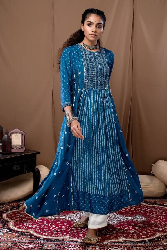 Blue anarkali in bandhani print with mirror and thread embroidery on the yoke. Paired with off-white cotton silk pant. Component: 2 Pattern: Printed Type Of Work: Bandhani Neckline: Round Sleeve Type: Straight Three Quarter Fabric: Cotton Silk Color: Blue Other Details:  Cutwork hem anarkali and pant Occasion: Puja - Aza Fashions Bandhani Print Anarkali, Blue Anarkali, Bandhani Print, French Knot Embroidery, Silk Pant, Pant For Women, Green Fits, Organza Dupatta, Kurta With Pants