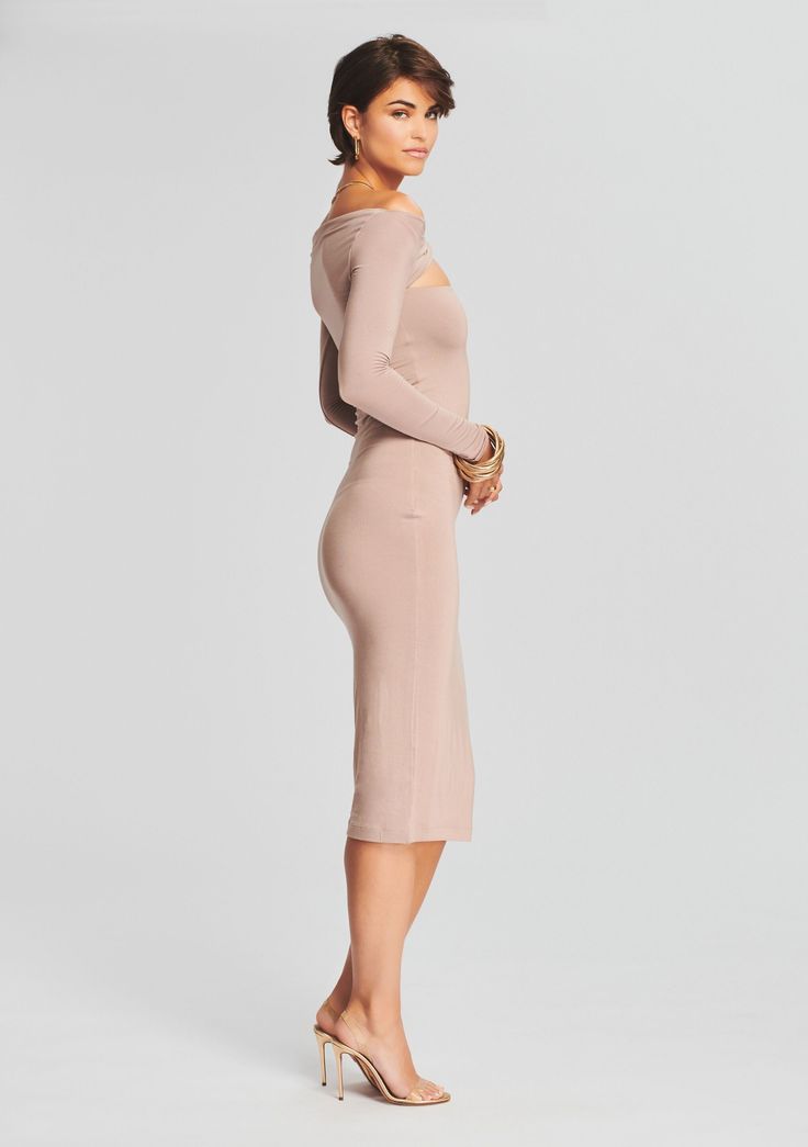 Simply seductive, our Irene Dress offers a body-hugging fit. The long sleeved midi features peek-a-boo detailing at the collarbone and is crafted in a luxe stretchy knit. Shown here in Dark Beige. 95% Modal, 5% Spandex Made in China Model is 5'10" wearing size S Style No. 4268-17 About SER.O.YA Established in 2020, SER.O.YA is a New York-based ready-to-wear label founded with the intention to upgrade and refine your wardrobe. With a focus on crafting effortlessly cool and timelessly luxurious de Irene Dress, Australia Clothes, Dark Beige, Peek A Boo, Denim Pant, Shopping List, Cold Shoulder Dress, High Neck Dress, Dresses For Work