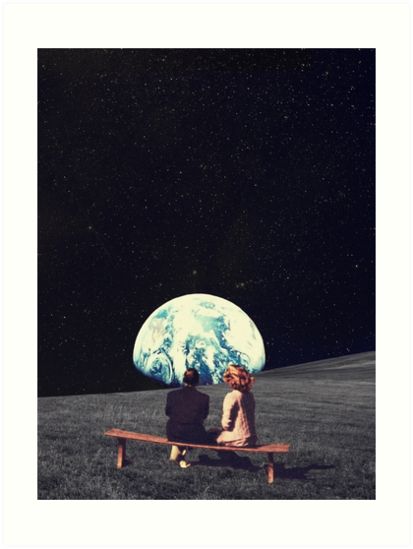 two people sitting on a bench looking at the earth