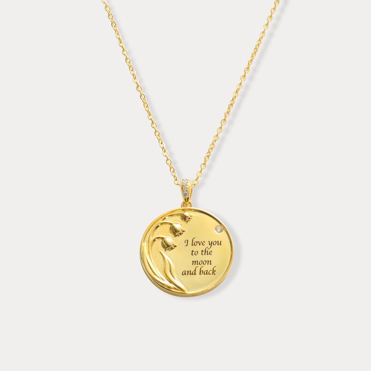 Embrace the beauty of this Lily of the Valley Personalized Coin Pendant Necklace, a luxurious piece that beautifully blends elegance with sentiment. This stunning gold coin pendant features an intricately engraved lily of the valley motif, symbolizing purity and sweetness, alongside a personalized message which can be decided by you for someone special. Crafted from high-quality 18K gold, this necklace radiates warmth and sophistication, making it a perfect keepsake or gift for a loved one. Its Elegant Hallmarked Coin Necklace, Elegant Engraved Gold Plated Coin Necklace, Elegant Engraved Gold-plated Coin Necklace, Yellow Gold Coin Necklace Gift, Luxury Gift Coin Necklace, Elegant Gold Plated Medallion Necklace As Gift, Elegant Gold Plated Medallion Necklace For Gift, Elegant Gold-plated Medallion Necklace As Gift, Elegant Coin Necklaces For Anniversary