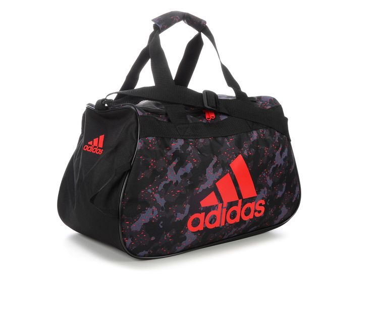 Adidas Diablo Small Printed Duffel Bag. Carry your gym gear in style with the Adidas Diablo Duffel Bag! Not only will the oversized Adidas logo and label keep your style sporty, but the top-loading design makes it easy to load up your exercise essentials. 100% polyester, Adidas 3-stripe logo and label detail spans the front, Adjustable shoulder straps, Dimensions: 17\W x 10\D x 11\H, Padded handles, Reinforced bottom, Top-loading main compartment | Adidas Diablo Small Duffel Bag in Camo Black/Re Exercise Essentials, Loading Design, Gym Gear, Adidas Logo, Duffel Bag, Shoulder Straps, Black Red, Camo, Handles