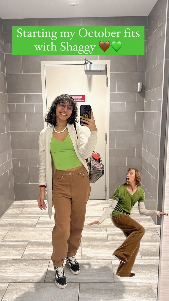 a woman taking a selfie in front of a mirror with another woman standing next to her