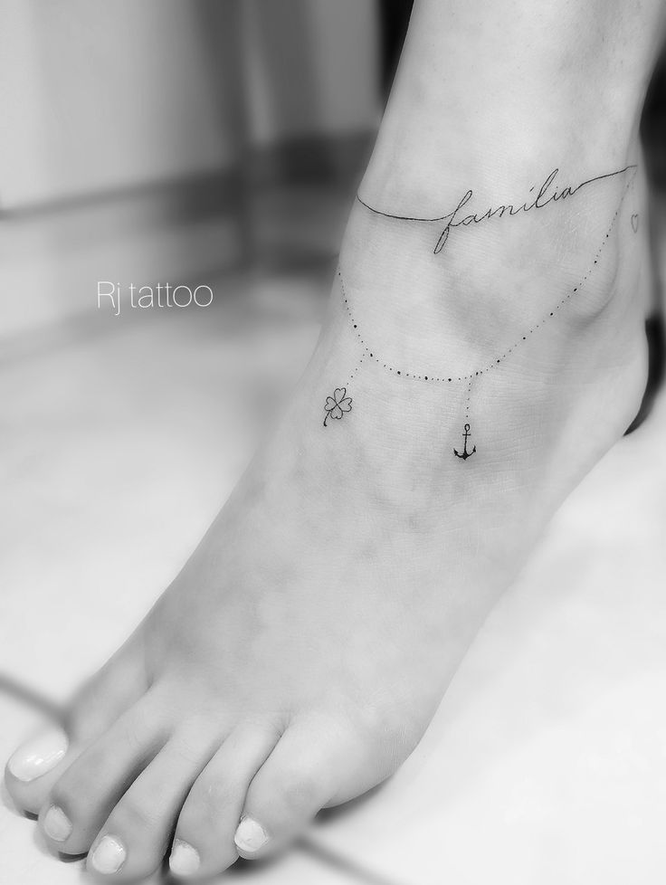 a woman's foot with an anchor and name tattoo on the side of her ankle