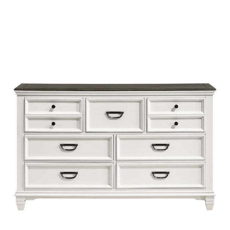 a white dresser with black top and drawers on the bottom, in front of a white background