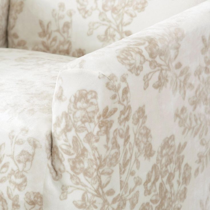 the back end of a bed with floral print on it